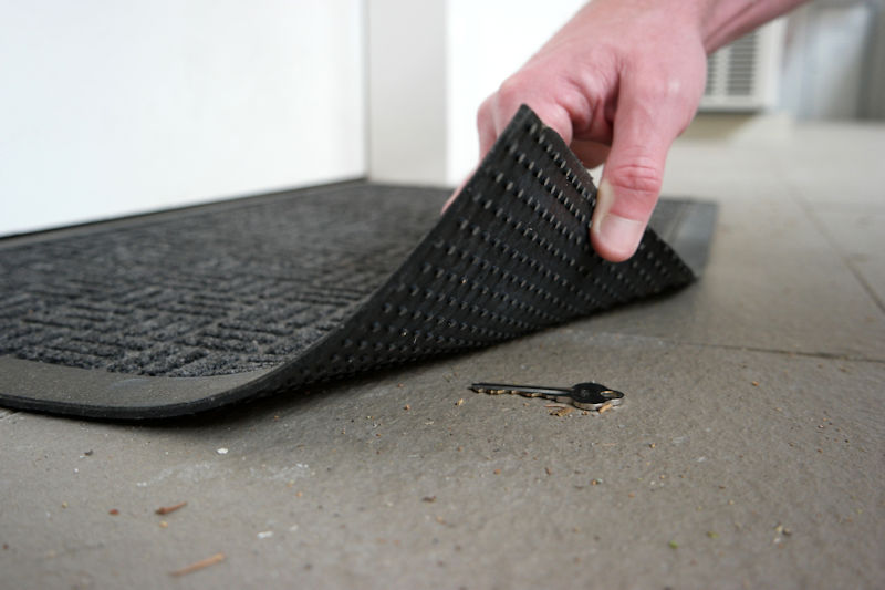 key under a door mat